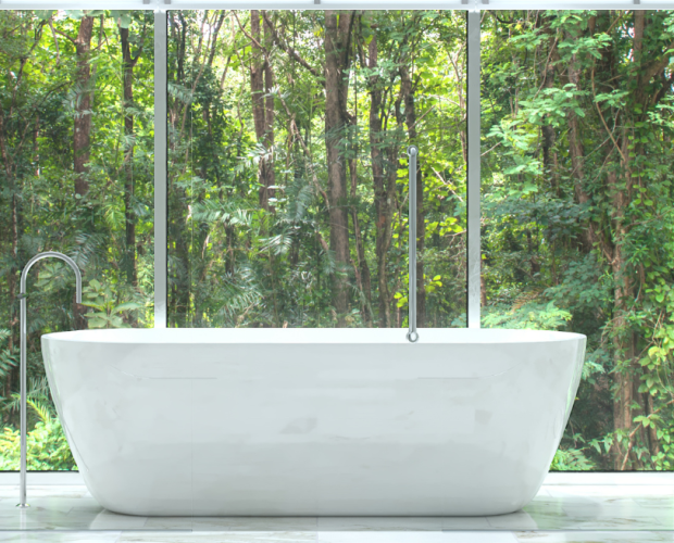 White bathroom with rainforest in background.